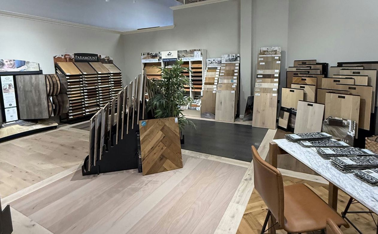 Laminate flooring showroom display with patterned flooring tiles and boards